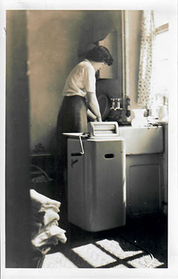 My mother at the kitchen sink